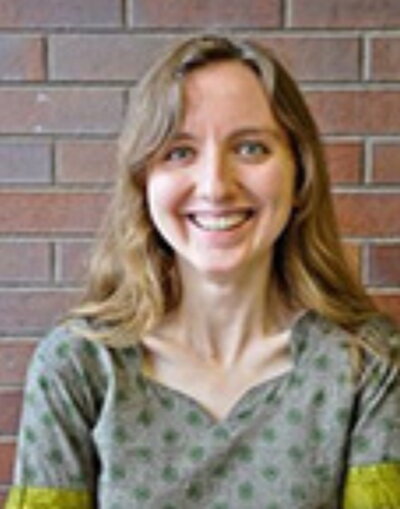 Image of Courtney Averkamp in front of brick wall